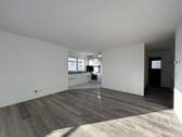 Wohn- und Essbereich - Lichtdurchflutete 3,5 Zimmer-Neubauwohnung mit Einbauküche zu vermieten!