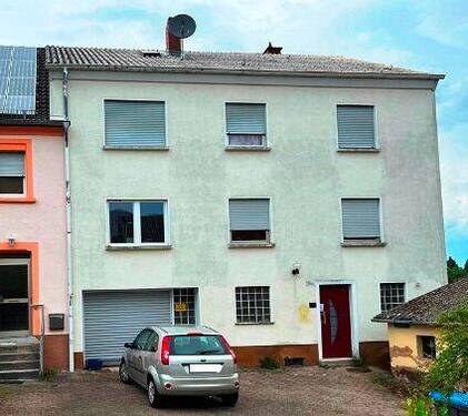 Ansicht - Einfamilienhaus mit Garage - 84.980,00 EUR Kaufpreis, ca.  160,00 m² Wohnfläche