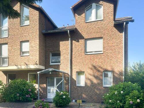 Front - Gepflegte, helle ETW über 2 Etagen mit Süd-West-Garten und Garage