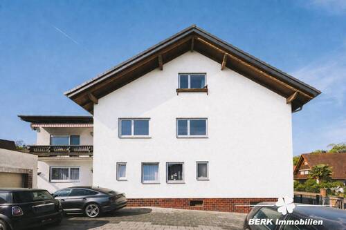 Hausansicht - (KI optimiert) - 1 Zimmer Mehrfamilienhaus, Wohnhaus zum Kaufen in Stockstadt am Main