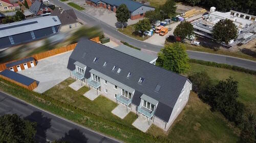 Luftbild - Energieeffiziente und altersgerechte OG Neubau Eigentumswohnung in Weddingstedt -Provisionsfrei-