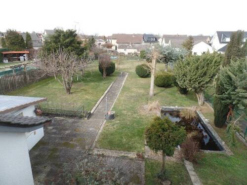 Blick vom Wohnzimmer im Obergeschoss in den Garten - 