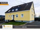 Straßenansicht. - Top Lage trifft Top Zustand: Ein-Zweifamilienhaus mit gehobenem Wohnkomfort