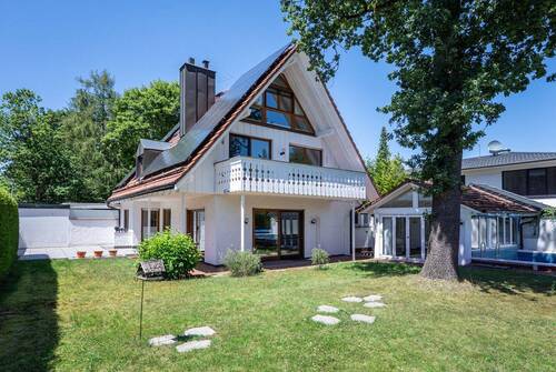 Gartenansicht - AIGNER - Charmante Doppelhaushälfte mit Gartenparadies in begehrter Lage von Gräfelfing