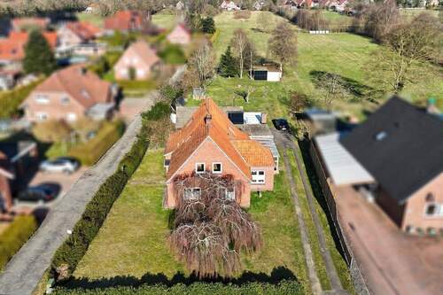 Frontansicht mit Weitblick - Einfamilienhaus mit 160,00 m&sup2; in Moormerland zum Kaufen