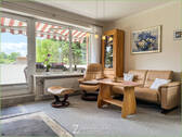 Wohnbereich mit Zugang zum Balkon - 2 Zimmer Etagenwohnung in Garding