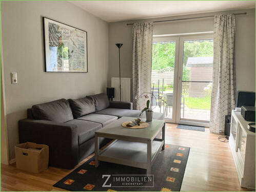 Wohnzimmer mit Zugang zur Terrasse - 3 Zimmer Etagenwohnung zum Kaufen in Garding