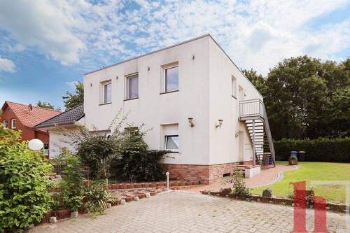 Außenansicht - Helle Eigentumswohnung im Obergeschoss eines Zweifamilienhauses in Lohne