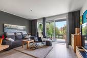 Wohnzimmer - Barrierefreies Wohnen auf höchstem Niveau - Erdgeschosswohnung mit eigenem Garten in Widdersdorf
