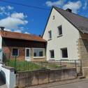 Hausansicht mit Anbau - Einfamilienhaus mit 124,50 m² in Staudernheim zum Kaufen