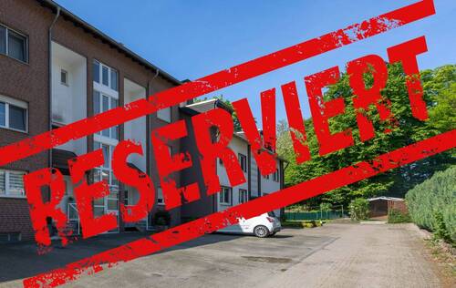 Frontansicht - Helle 4 Zimmer-Wohnung in begehrter Wohnlage mit Loggia, Kaminofen, eigener Garage & Stellplatz
