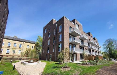 Außenansicht (Mit KI erstellt) - Ihr neues Zuhause im Herzen der Stadt und fußläufig zur Schlei!