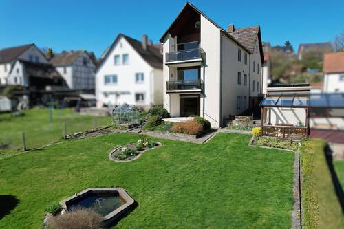 Hausansicht - 1 Zimmer Mehrfamilienhaus, Wohnhaus zum Kaufen in Derental