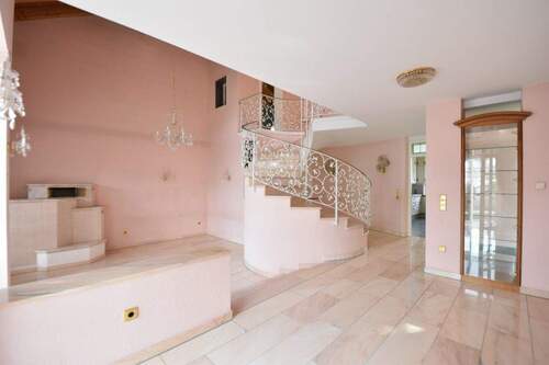 offener Wohnbereich mit Kachelofen - Einfamilienhaus mit 215,00 m&sup2; in Limburgerhof zum Kaufen