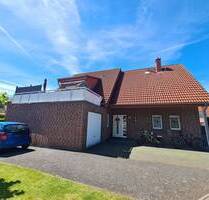 Ahlener Westen, eine aktuell vermietete 4-Zimmer-Erdgeschosswohnung mit Garten und Garage.