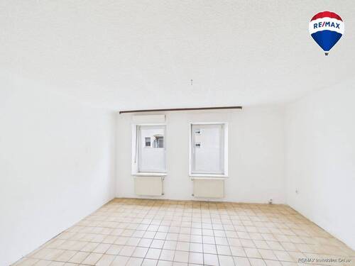 RE:MAX Immobilien DeLux Saarlouis-Roden Wohnzimmer - Reihenmittelhaus mit 120,00 m² in Saarlouis / Roden zum Kaufen