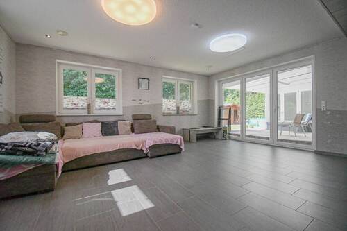 Wohnzimmer - Einfamilienhaus mit 274,40 m² in Bösel zum Kaufen