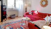 Wohnzimmer mit Kaminofen EG - 