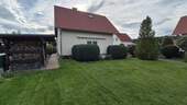 Blick aufs Haus aus dem Garten - Einfamilienhaus mit 118,00 m² in Weißwasser zum Kaufen