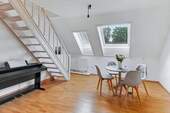 Wohnzimmer - Eleganz auf zwei Etagen - Ihre besondere Dachgeschoss-Wohnung