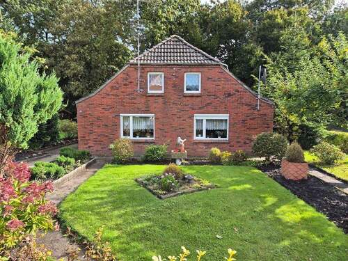 Giebelansicht Straße - 3 Zimmer Einfamilienhaus zum Kaufen in Wangerland