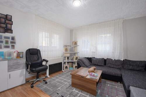 Wohnzimmer EG Anbau - 1 Zimmer Einfamilienhaus zum Kaufen in Neuhausen