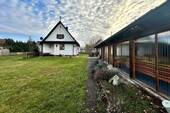 Hausansicht mit Anbau Garage - Einfamilienhaus mit 83,00 m² in Untermeitingen zum Kaufen