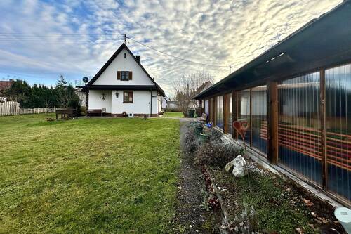 Hausansicht mit Anbau Garage - Einfamilienhaus mit 83,00 m² in Untermeitingen zum Kaufen
