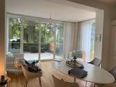 Essbereich mit Blick in den Wintergarten - Terrassenwohnung mit 177,80 m² in Hamburg zur Miete