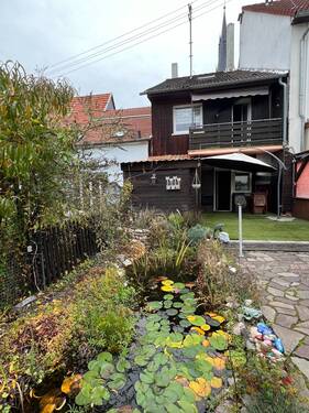Rückansicht mit Terrasse - Einfamilienhaus mit 125,00 m² in Bad Sobernheim zum Kaufen