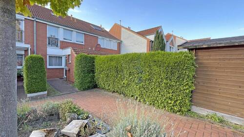 Ansicht - Familientraum in ruhiger Lage in Wettbergen - junges, gepflegtes RMH mit Garten, Garage & überdachter Abstellfläche