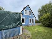 Rückansicht mit Garage/Stall - Einfamilienhaus mit 73,00 m&sup2; in Lehe zum Kaufen