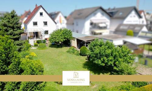 Hausansicht Gartenseite - Charmantes Ein-Zweifamilienhaus in ruhiger Wohnlage mit Traumgrundstück, Sonnenterrasse + Garage