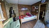 Ruhebereich im Saunahaus mit Kamin - 