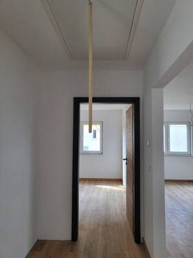 Bild 1 - Erstbezug: Helle 2-Zi-DG-Wohnung mit Carport und E-Ladestation