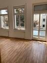 Wohnzimmer (1) - Wohnglück am Markt - Ihr neues Zuhause mit Balkon und Aufzug.
