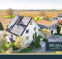 BRUMANI | Modernes Einfamilienhaus mit hochwertigem Anbau, Doppelgarage und Pool in Buggingen