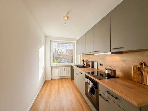 Moderne Küche mit Holzboden - Etagenwohnung mit 72,00 m² in Hamburg zum Kaufen