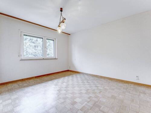 Schlafzimmer mit Parkettboden - 