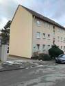 Seitliche Ansicht Wohngebäude mit Zufahrt zum Hof - 3 Zimmer Etagenwohnung in Darmstadt