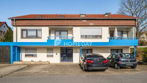 Außenansicht 1 - Solide vermietetes Mehrfamilienhaus mit 6 Wohneinheiten, Garten und Doppelgarage in ruhiger Hanglage