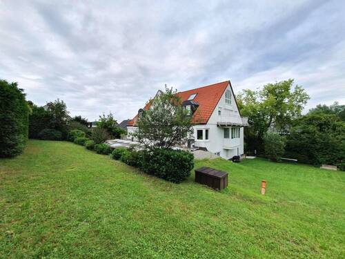 Gartenansicht - Gepflegtes Mehrfamilienhaus mit 7 Wohneinheiten und 11 Tiefgaragen-Plätzen