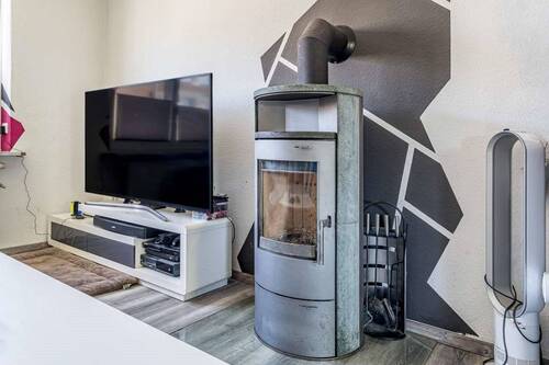 Wohnzimmer; Detailblick Ofen - 