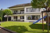Gartenansicht - Moderne ca. 95 m² große 4-Zimmer-Wohnung mit Tageslichtbad ruhig gelegen im Hagener Süden
