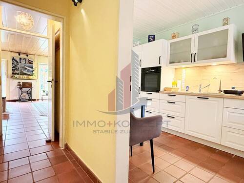 Weiter im Flur geht es entweder ins Wohnzimmer - Reihenmittelhaus mit 107,30 m² in Recke zum Kaufen