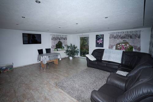 Wohnzimmer EG vermietetes Haus 1 - 