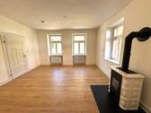  Wohnzimmer mit Kachelofen - 