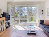 K24_Wohnzimmer mit Loggia - Etagenwohnung mit 95,20 m&sup2; in München zum Kaufen