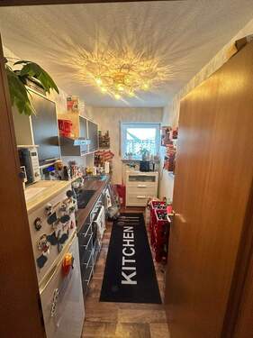 Küchenbereich mit Einbauküche - 