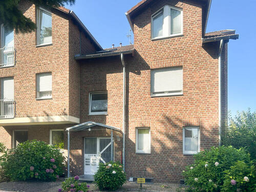 Front - Gepflegte, helle ETW über 2 Etagen mit Süd-West-Garten und Garage